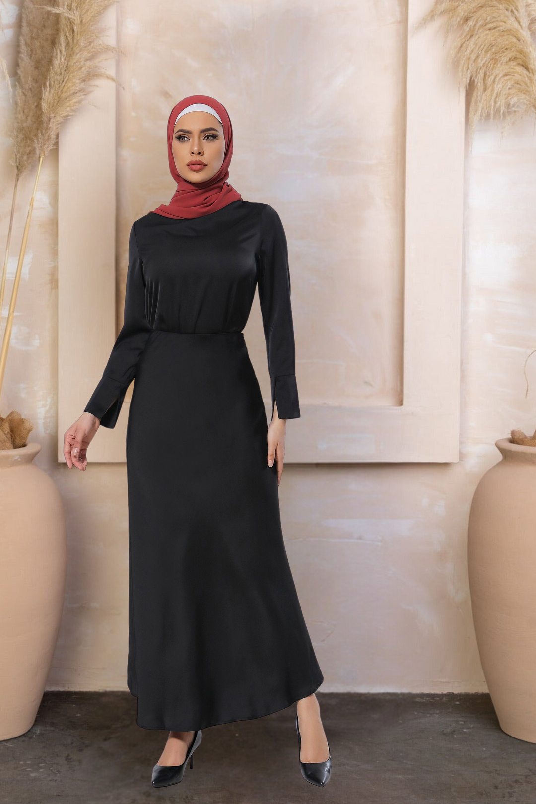 Woman in a black dress and red hijab wearing a satin long sleeve skirt set