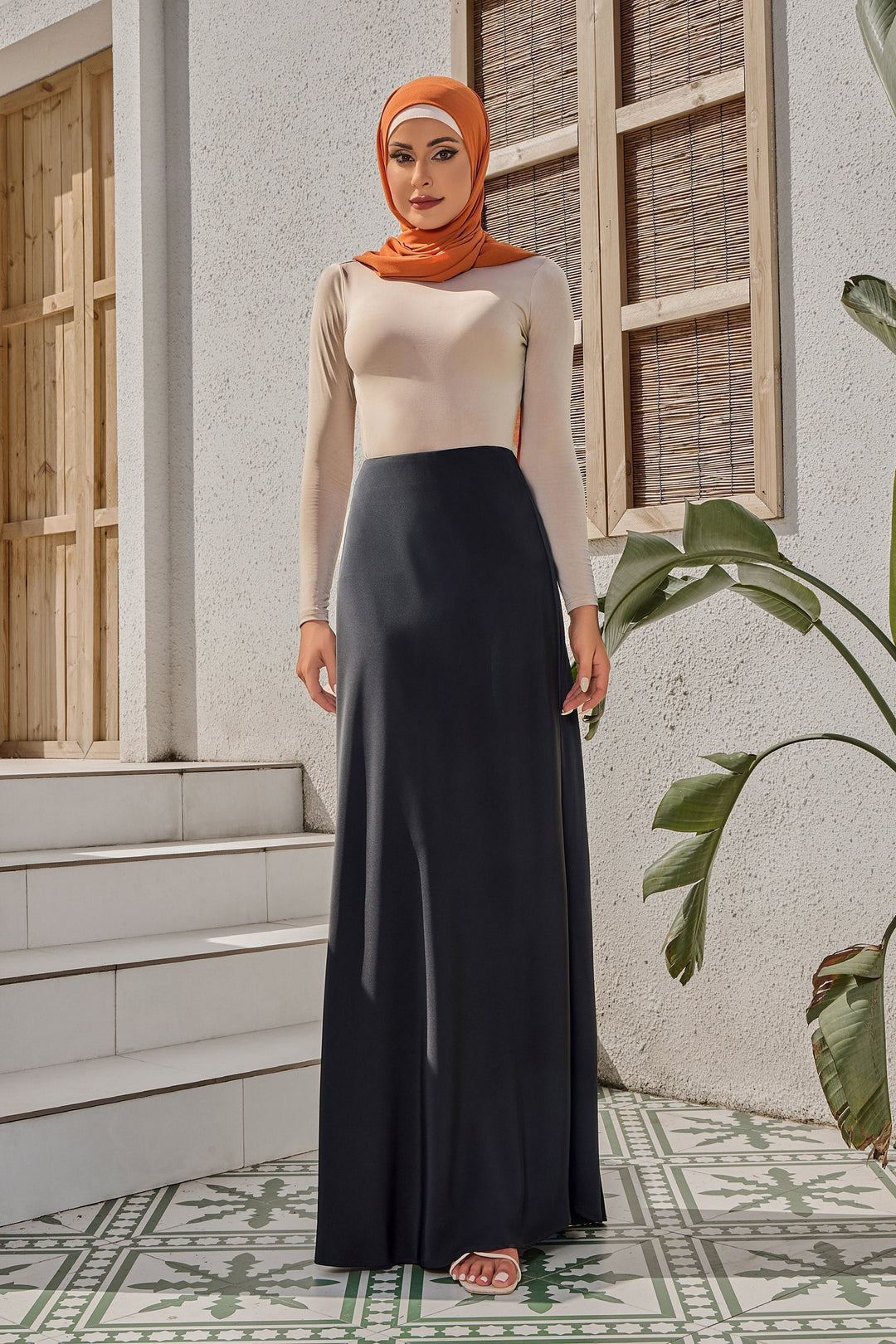 Woman in hijab modeling a Black Satin Maxi Skirt with elegant style