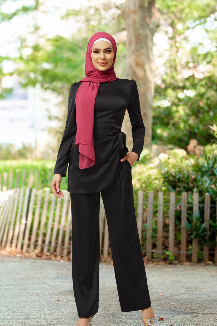 Woman in black pantsuit and pink hijab wearing Black Satin Wrap Tunic and Pant Set