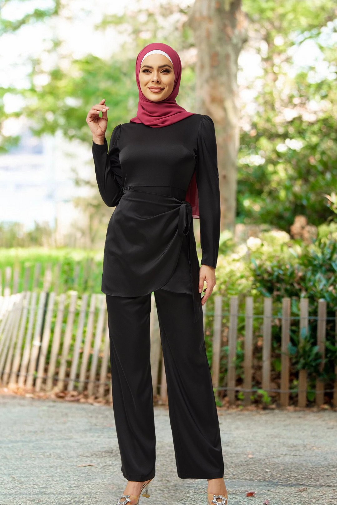 Woman wearing a Black Satin Side Wrap Tunic & Pant Set with maroon hijab