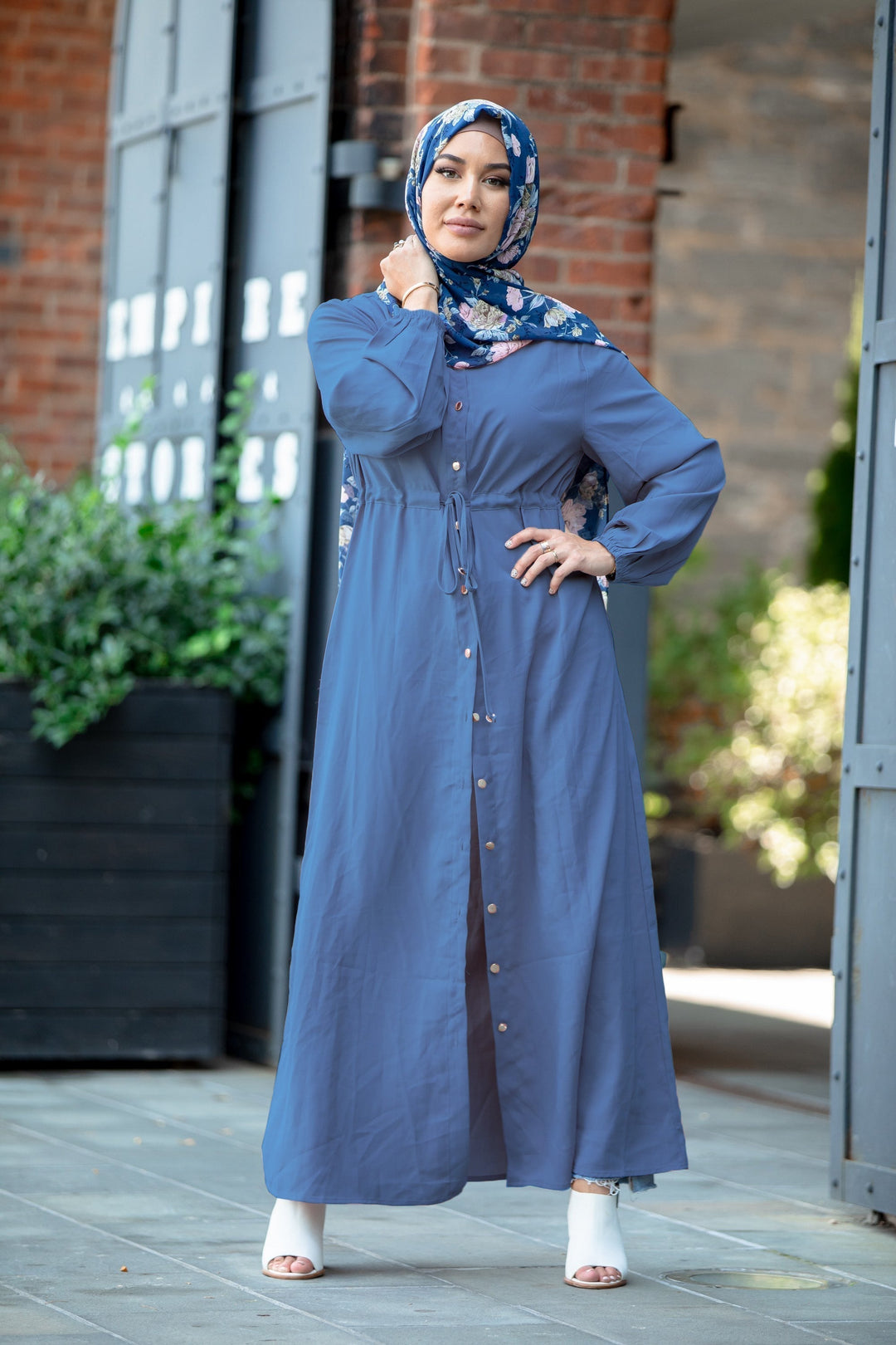 Woman in blue dress and floral hijab wearing a Blue Button Down Maxi Cardigan