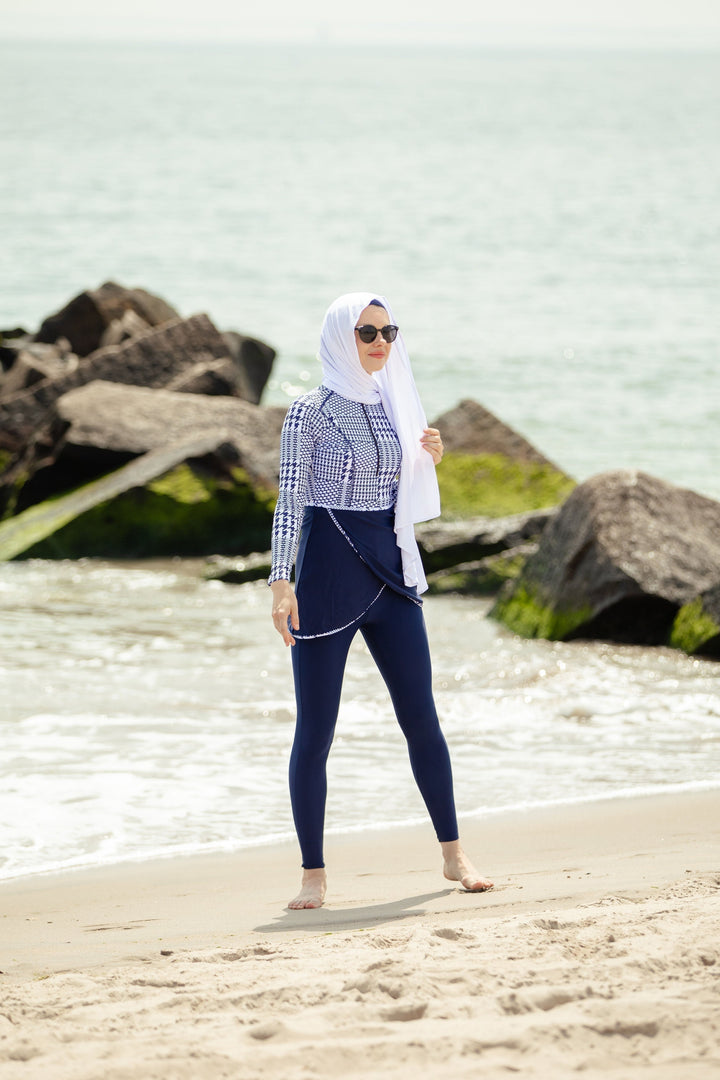 Modest swimwear featuring Blue Houndstooth Print on a sunny beach setting