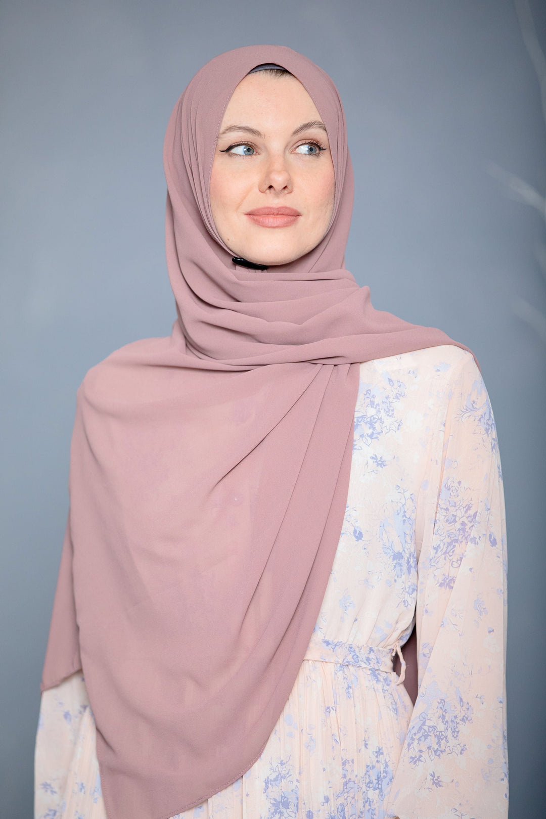 Woman in mauve hijab showcasing the elegance of Blush Pink Chiffon Scarf