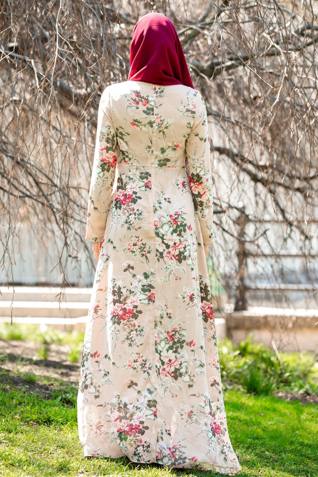 Floral-patterned long-sleeved dress with maroon hijab and blush pink ruffle accents