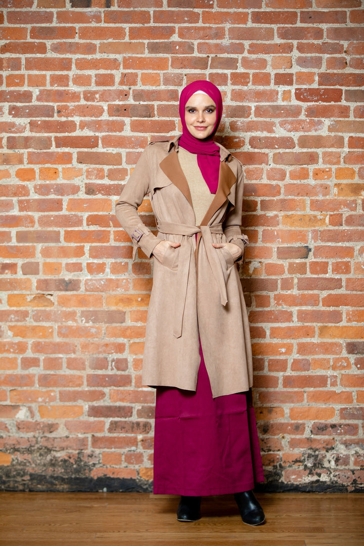 Woman in hijab and trench coat wearing a Burgundy Pencil Maxi Skirt on clearance