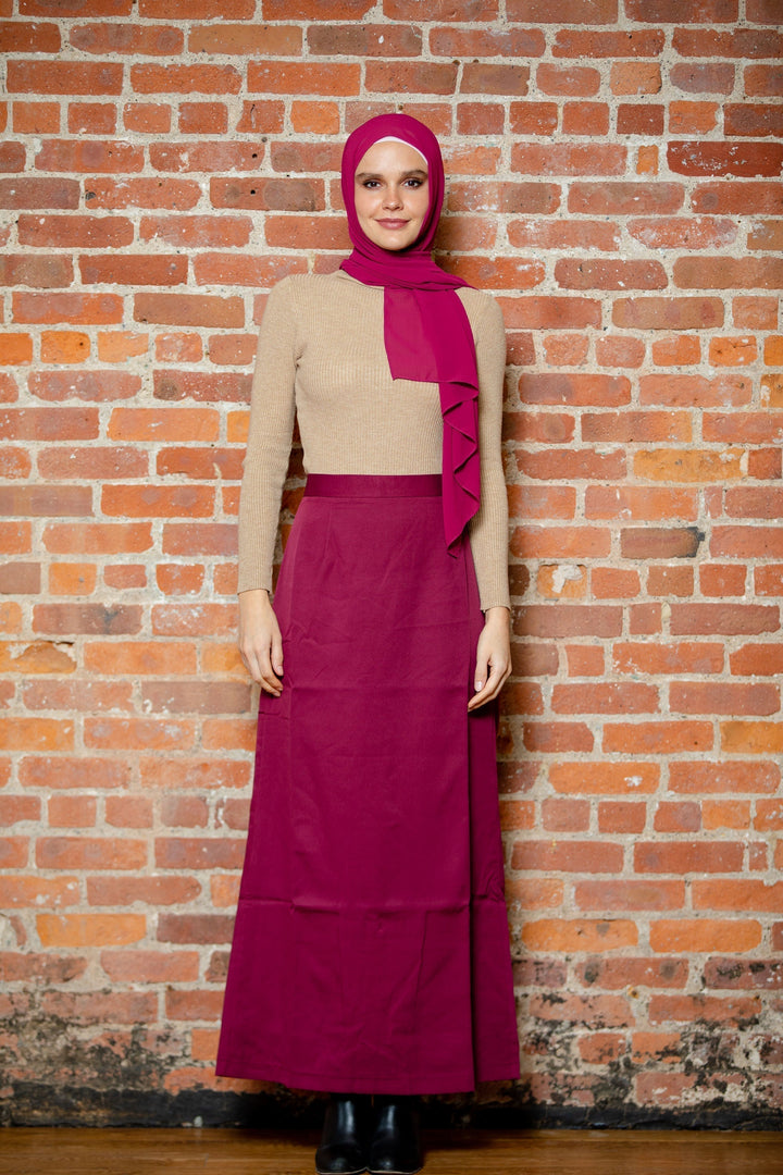 Woman in modest attire wearing a Burgundy Pencil Maxi Skirt available on clearance