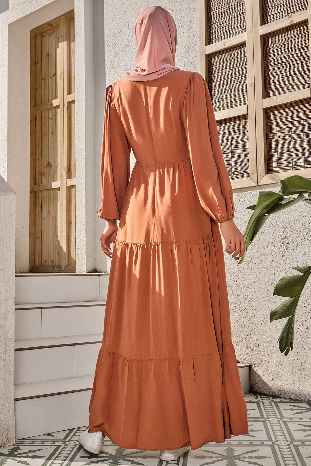 Long-sleeved burnt orange long sleeve maxi dress with a hijab, stylish and elegant