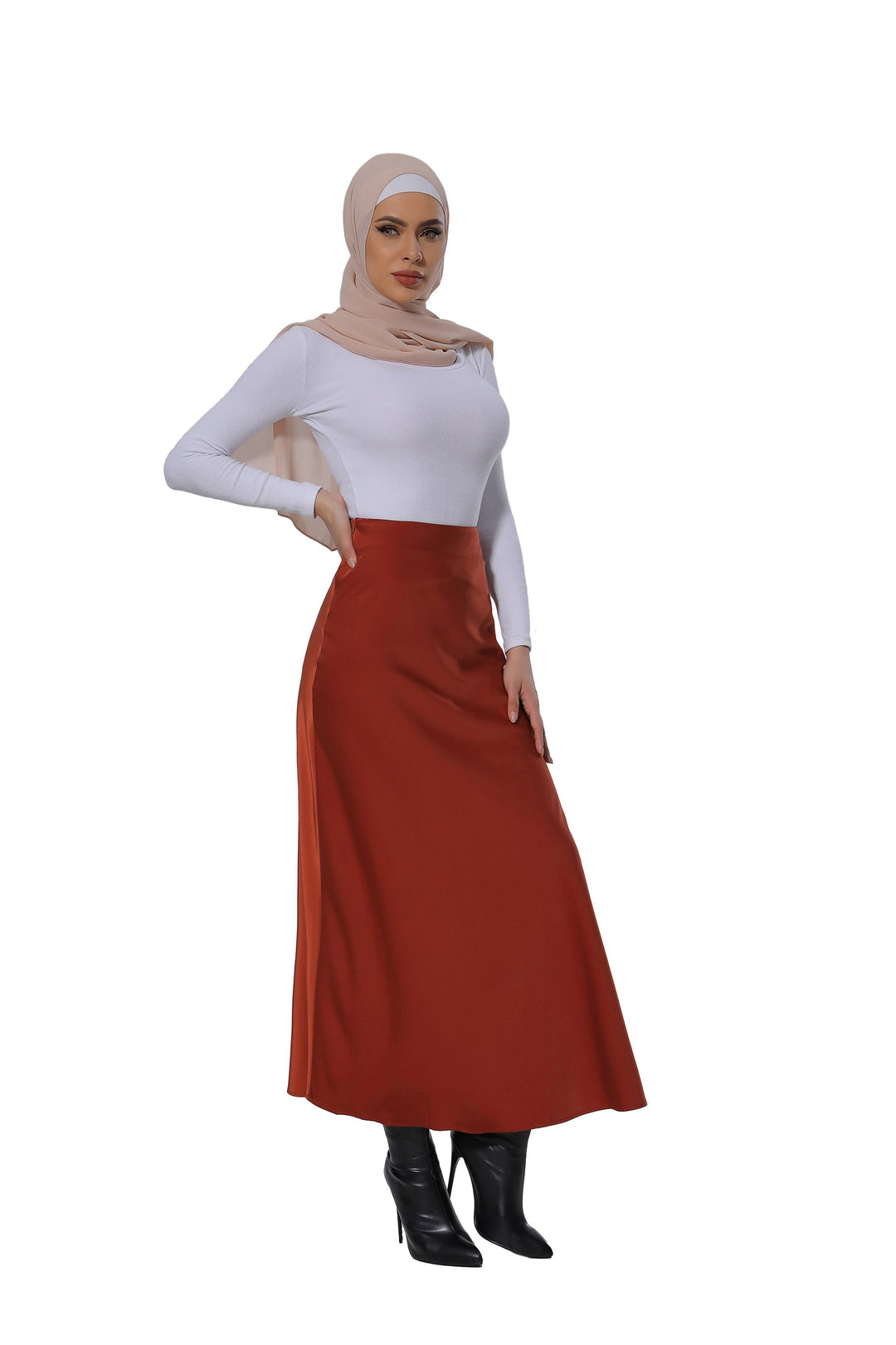 Woman in white top paired with a Burnt Orange Satin Skirt styled as a maxi skirt