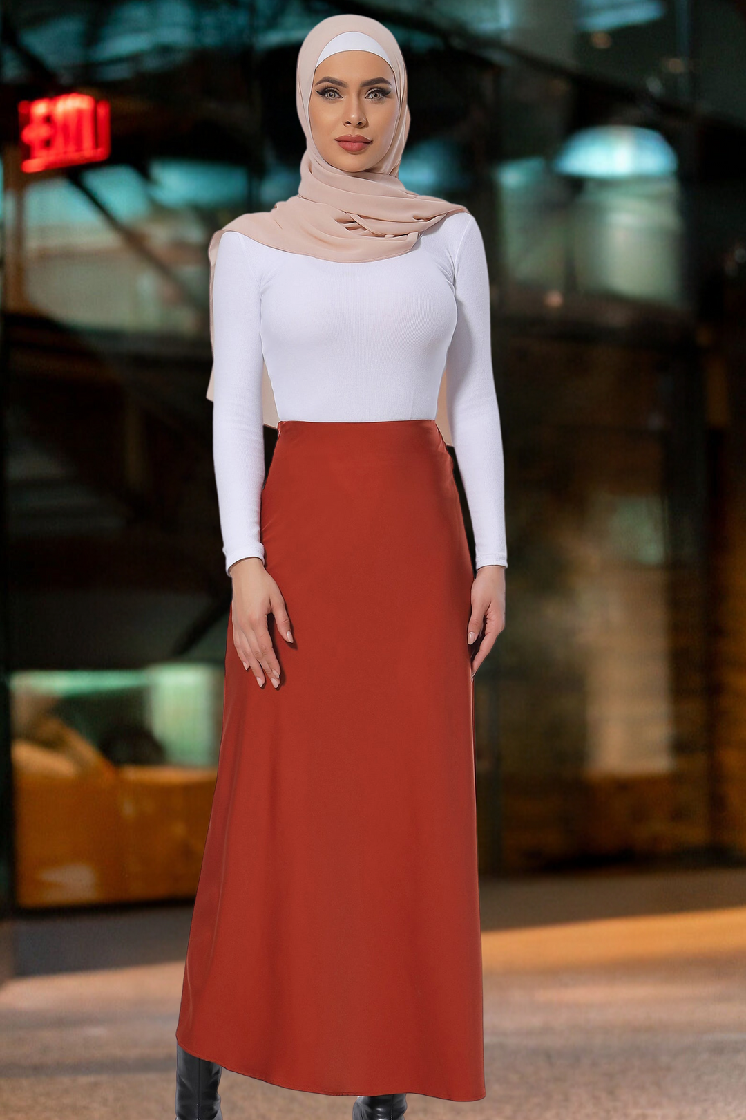 Woman in hijab wearing a white top and burnt orange satin skirt for stylish maxi dress looks