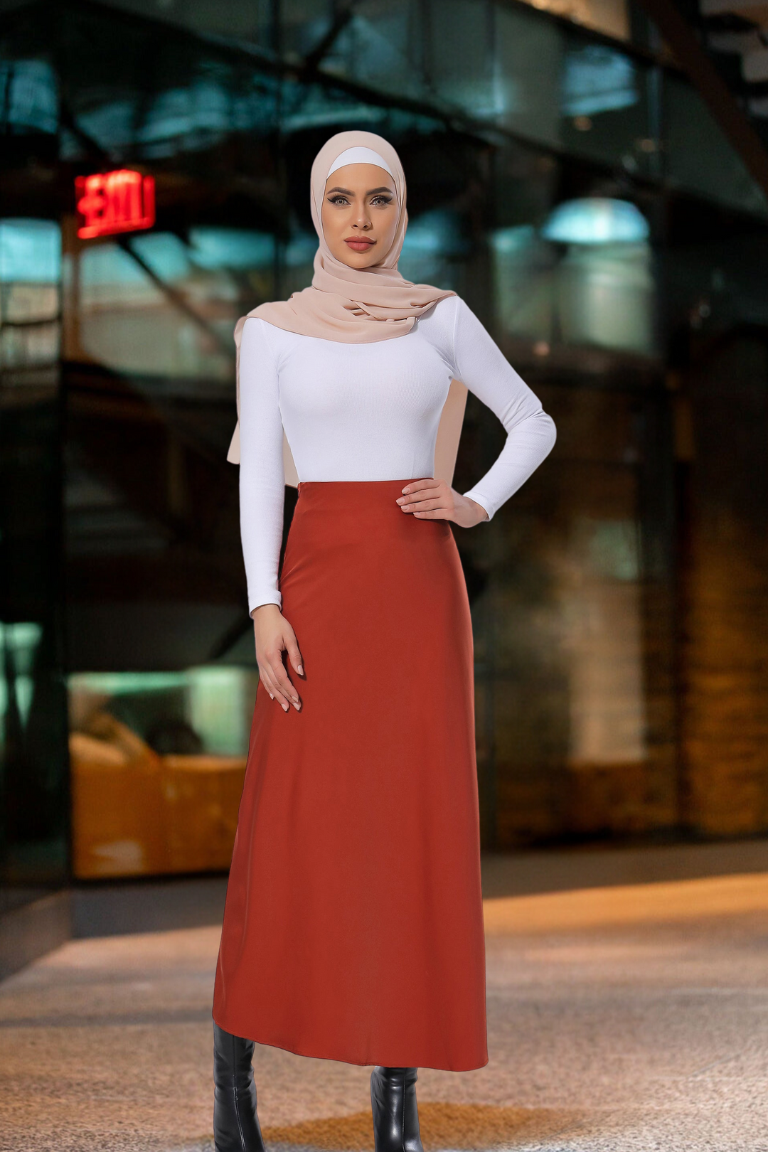 Woman in hijab modeling a Burnt Orange Satin Skirt with a white top