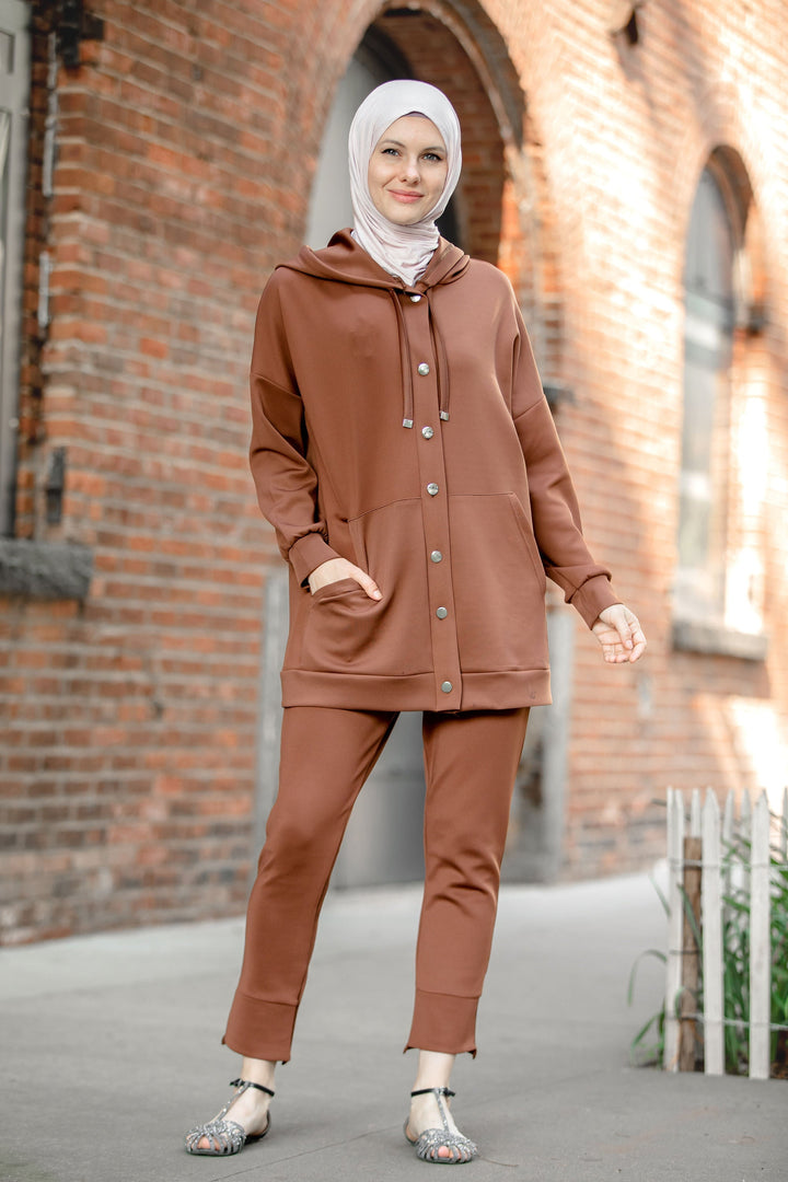 Woman in brown hooded tracksuit from the Button Down Hoodie Sweatshirt and Pants Set