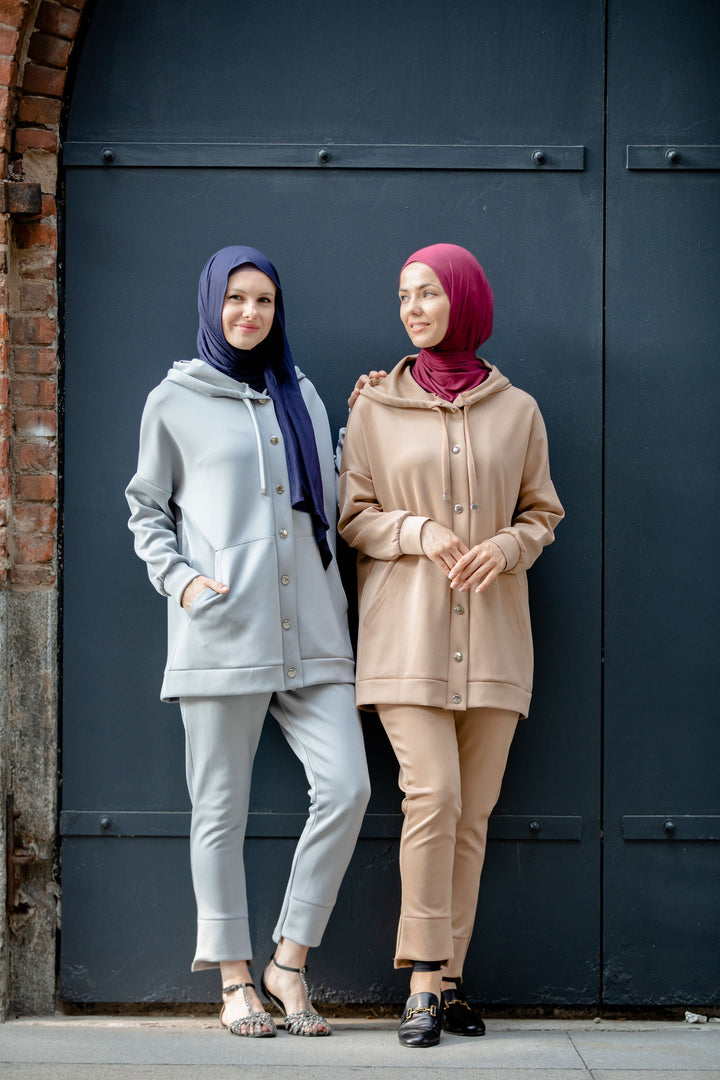 Two women in modest fashion wearing a stylish Button Down Hoodie Sweatshirt and Pants Set