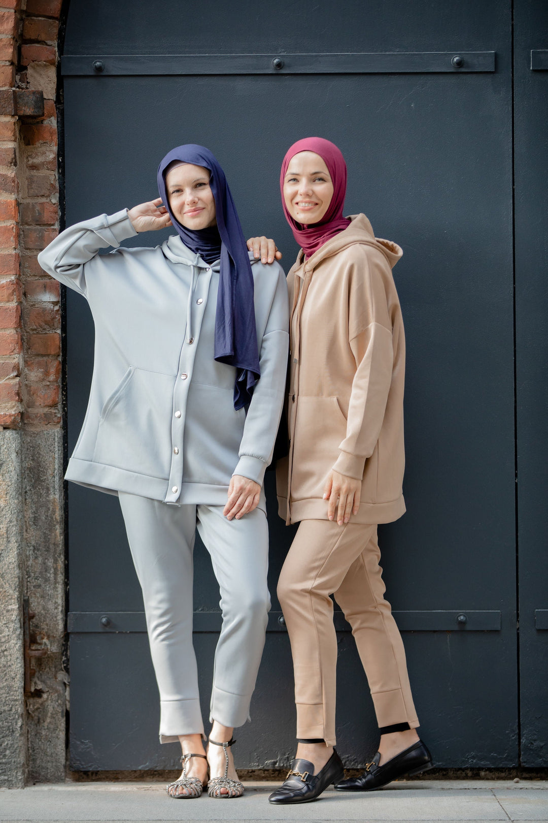 Two women in modest fashion wearing a Button Down Hoodie Sweatshirt and Pants Set