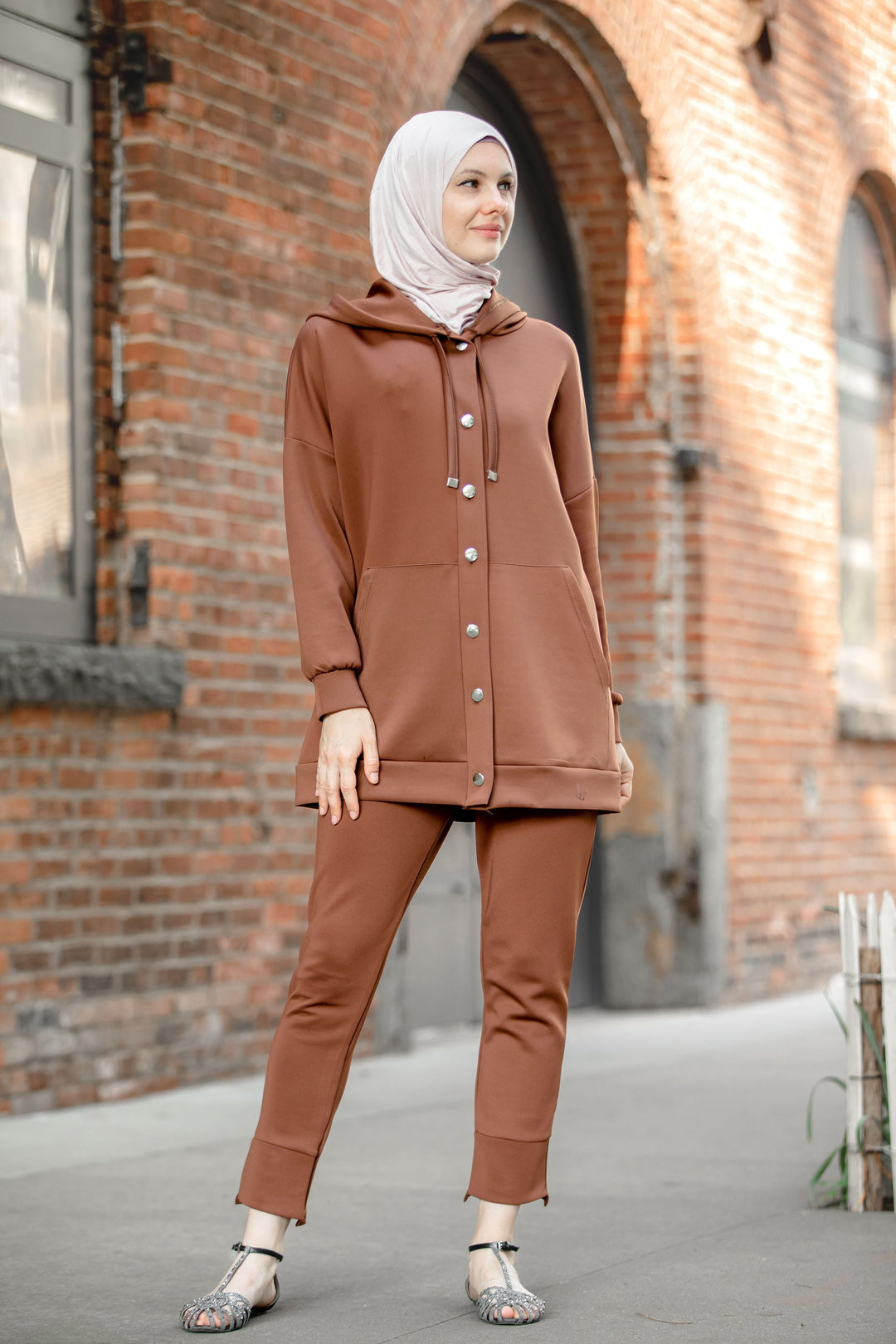 Woman wearing brown hooded tracksuit in Button Down Hoodie Sweatshirt and Pants Set