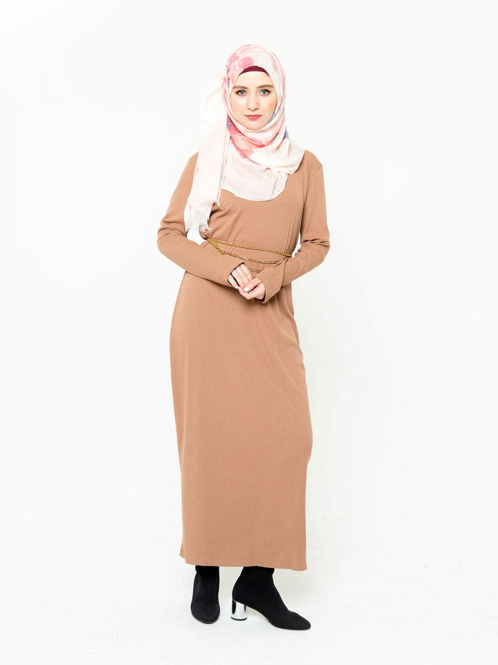 Woman in a tan ribbed long sleeve maxi dress showcasing premium jersey fabric