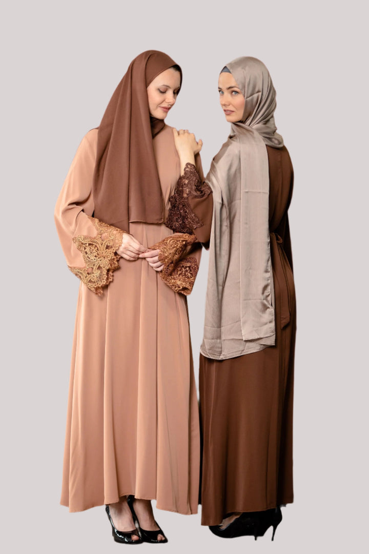 Two women in modest dresses wearing Coffee Lace Sleeve Zipper Abaya Dress with fabric tie belt