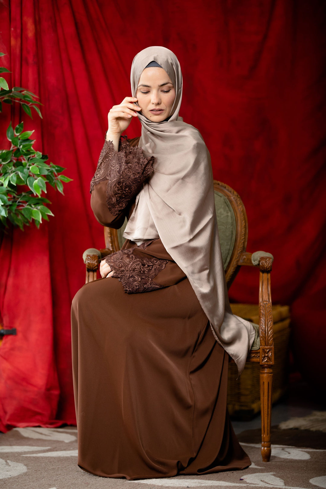 Woman in brown Coffee Lace Sleeve Front Zipper Abaya Dress with fabric tie belt