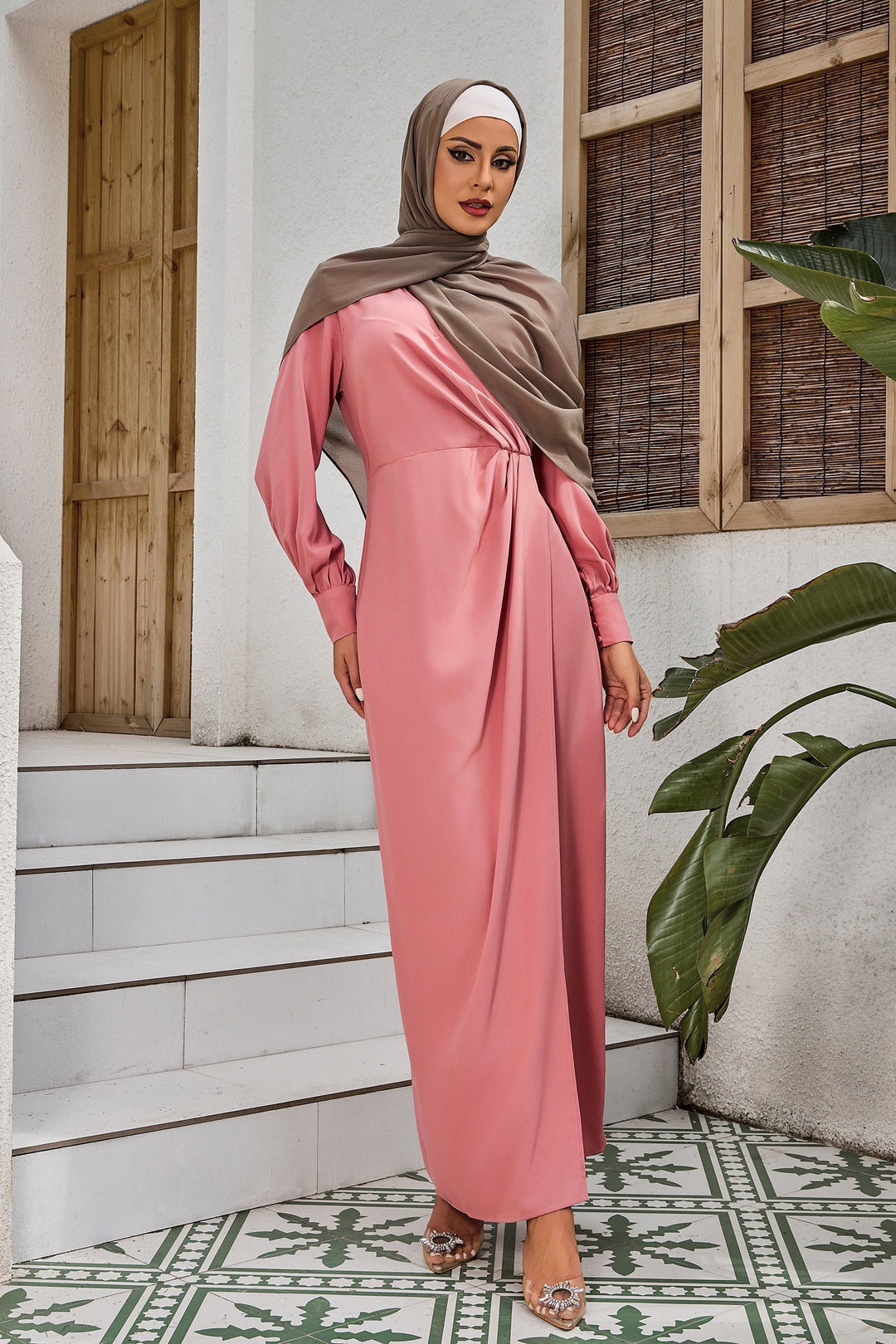 Woman in a pink hijab wearing a Coral Wrap Maxi Dress for elegant style