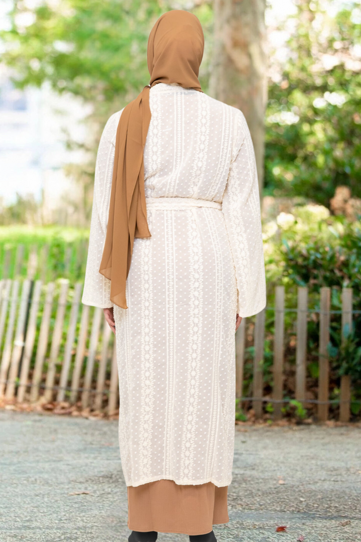 Woman in a tan hijab wearing a Lace Embroidered Sheer Midi Cardigan in cream