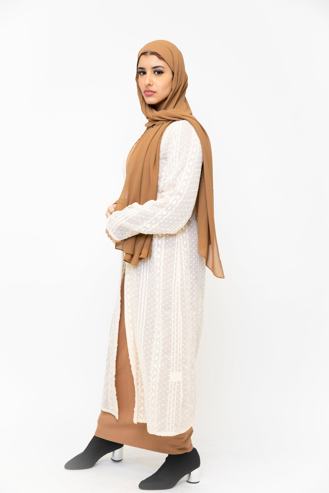 Woman in tan hijab and sequined dress showcasing Cream Boho Lace Embroidered Sheer Midi Cardigan