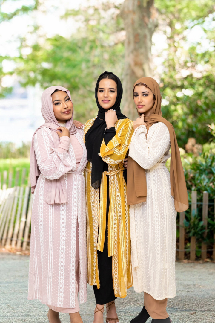 Three women wearing a Cream Boho Lace Embroidered Sheer Midi Cardigan in modest fashion