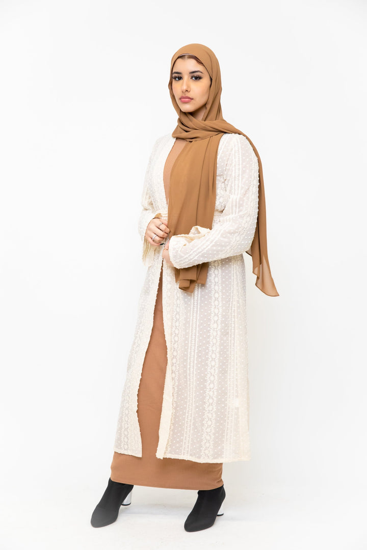 Woman in tan hijab and dress wearing a lace embroidered sheer midi cardigan