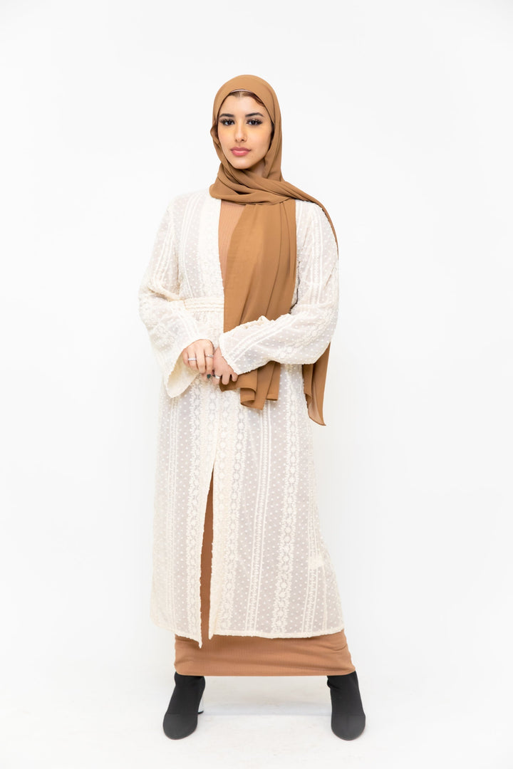 Woman in a tan hijab and dress styled with a lace embroidered sheer midi cardigan