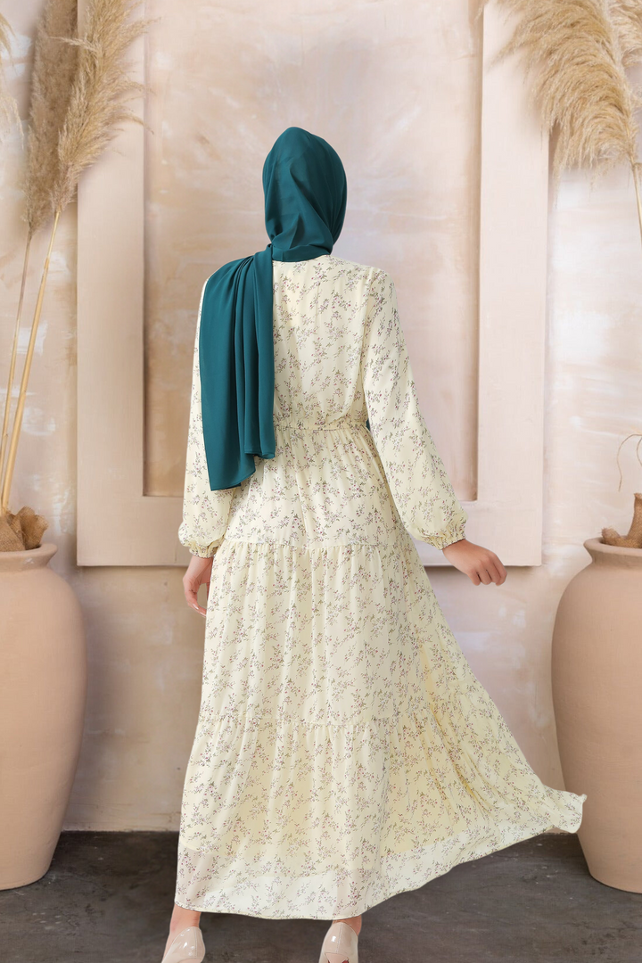 Woman in a Cream Floral Tiered Maxi Dress with hijab, showcasing elegant floral design