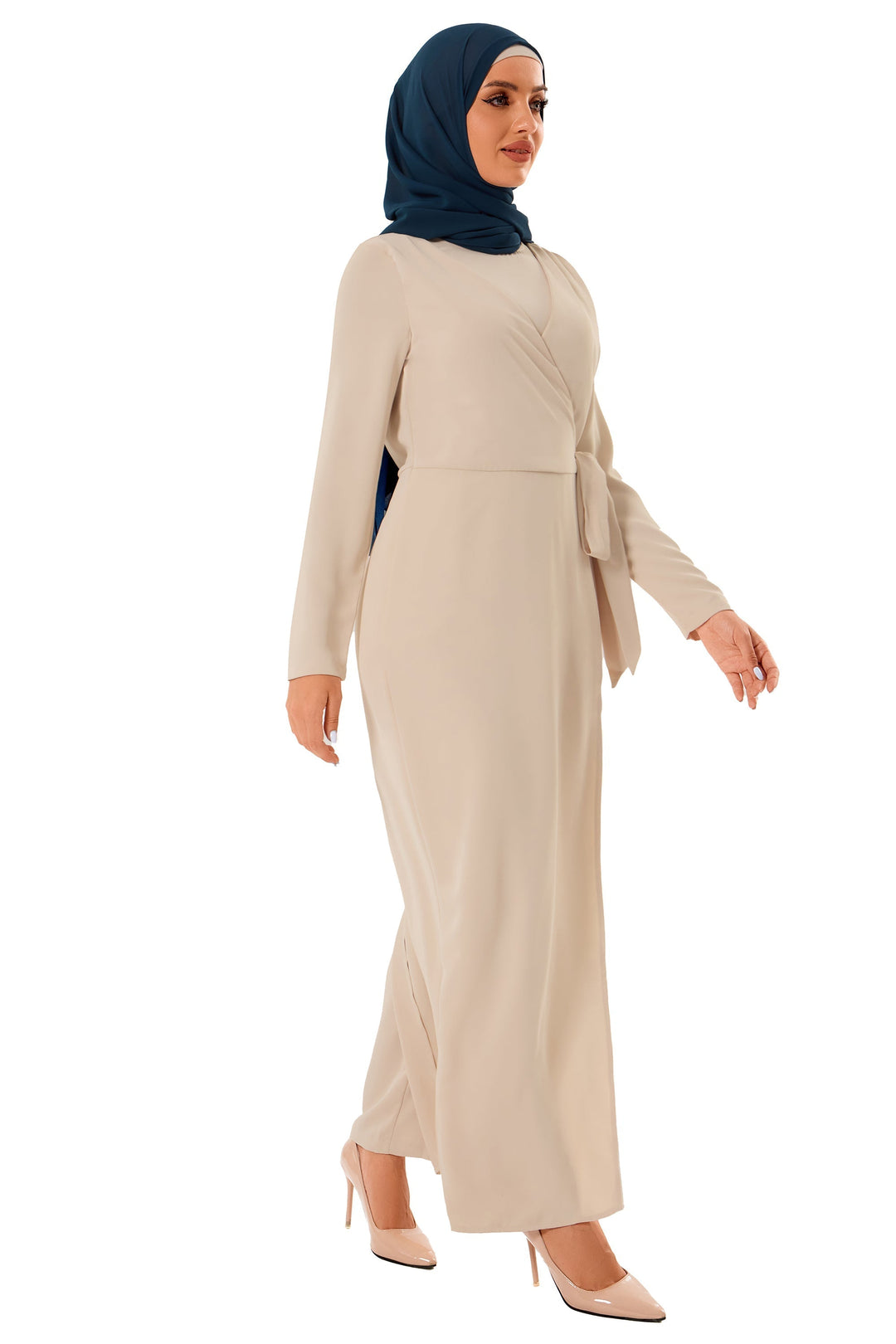 Woman in beige knot jumpsuit with dark blue hijab styled elegantly