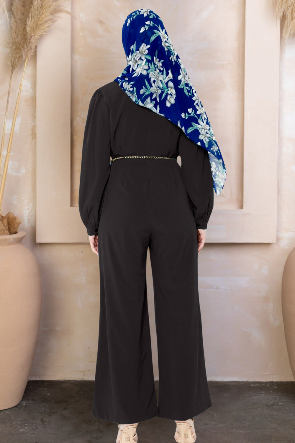 Black long sleeve jumpsuit with criss-cross neckline and floral hijab on clearance