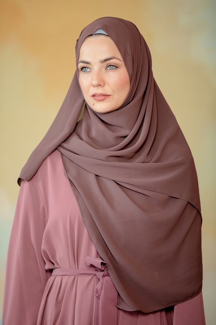 Woman in hijab and modest dress showcasing a Dark Brown Chiffon Hijab scarf