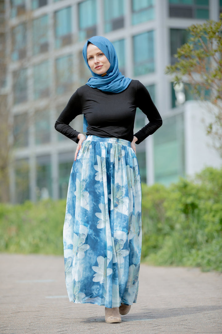 Woman in hijab wearing a Day Dreams Floral Maxi Skirt on clearance sale