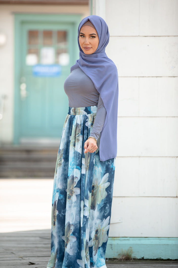 Woman in hijab wearing Day Dreams Floral Maxi Skirt displayed on clearance