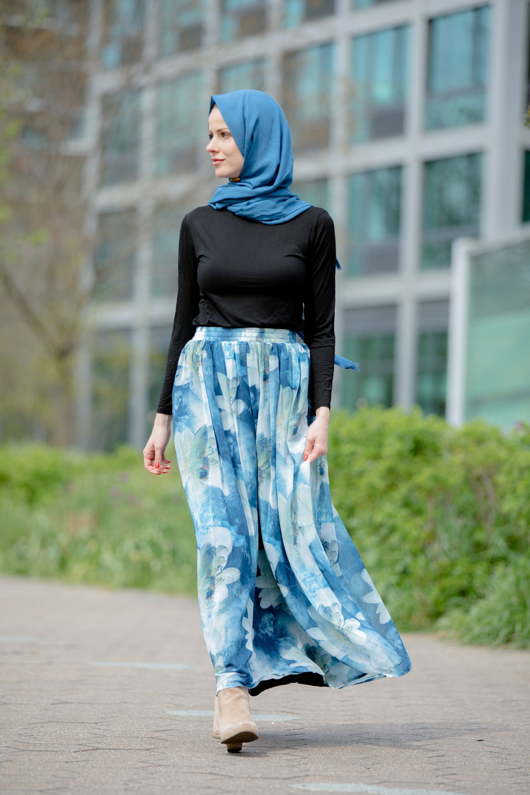 Woman in hijab wearing Day Dreams Floral Maxi Skirt displayed on clearance sale