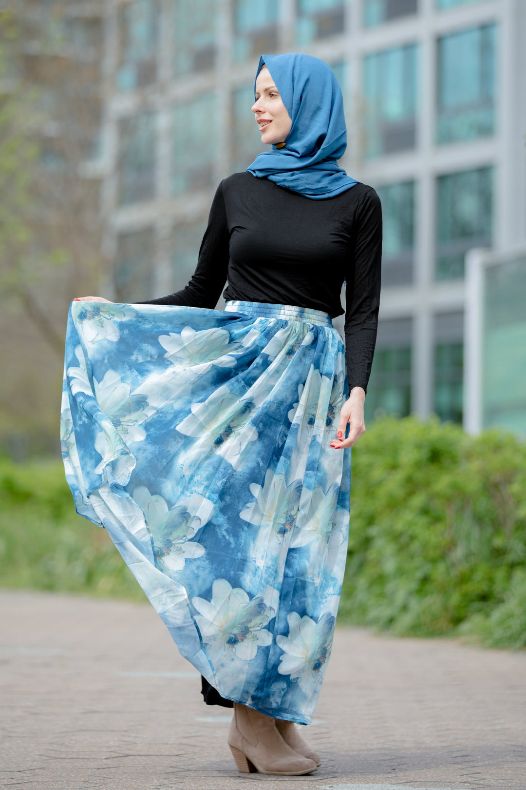 Woman in hijab wearing Day Dreams Floral Maxi Skirt showcasing a vibrant floral design