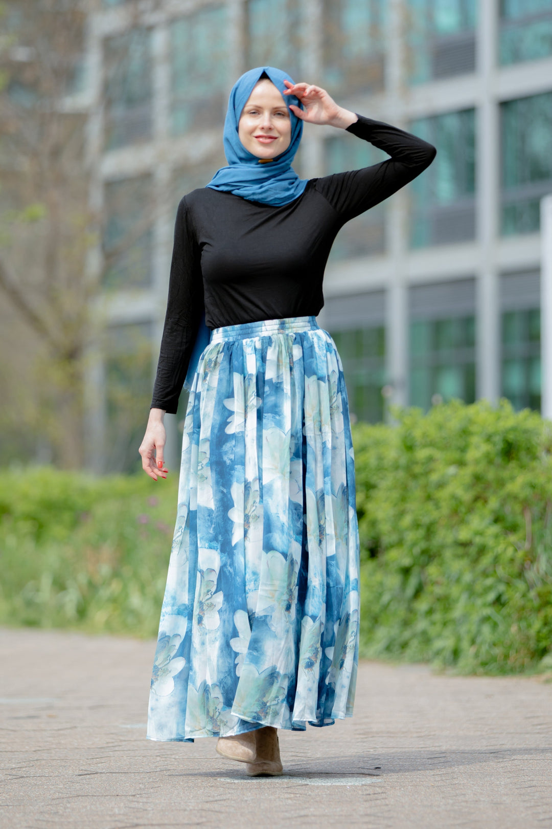 Woman in hijab wearing Day Dreams Floral Maxi Skirt on clearance sale