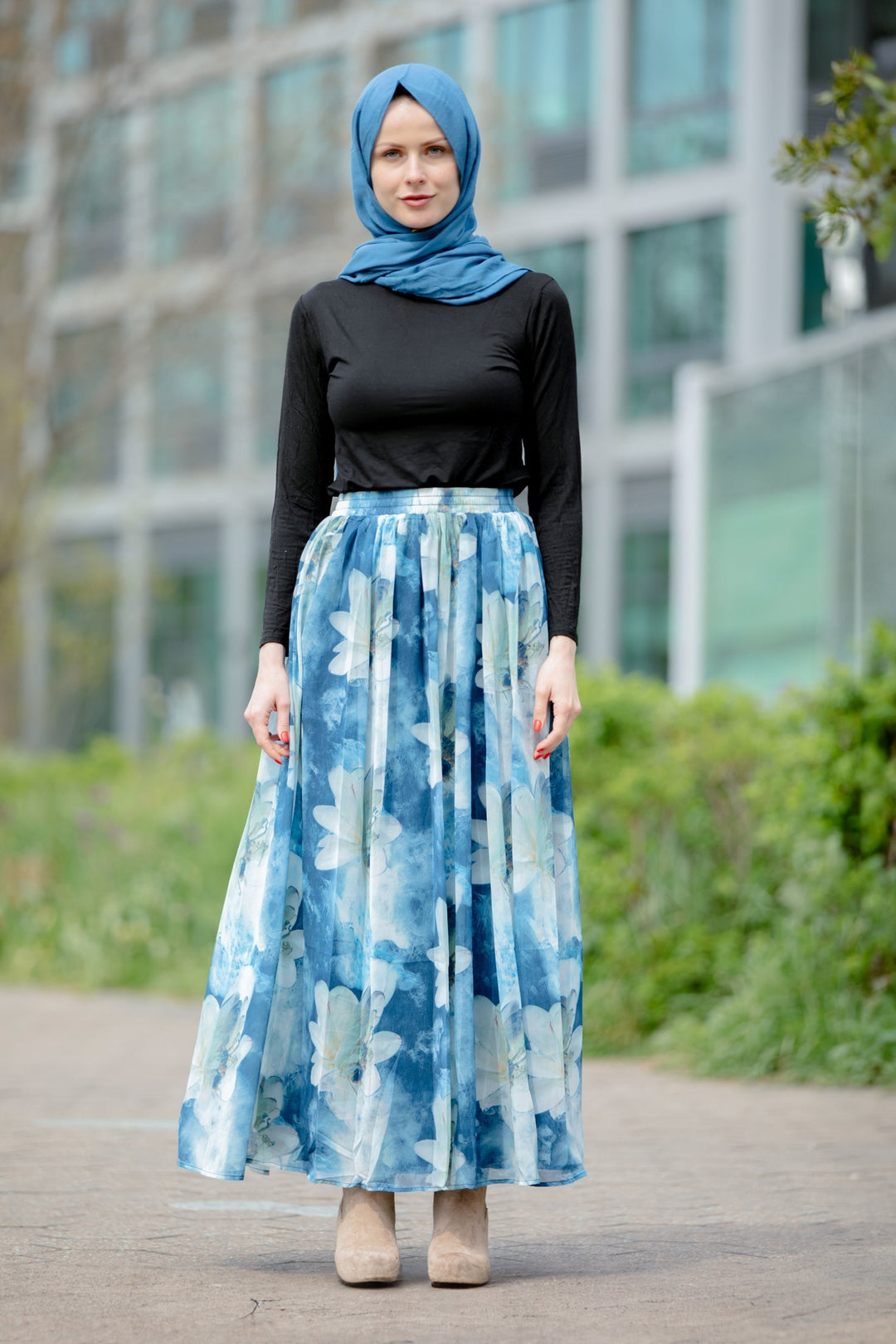 Woman in hijab wearing Day Dreams Floral Maxi Skirt on clearance sale