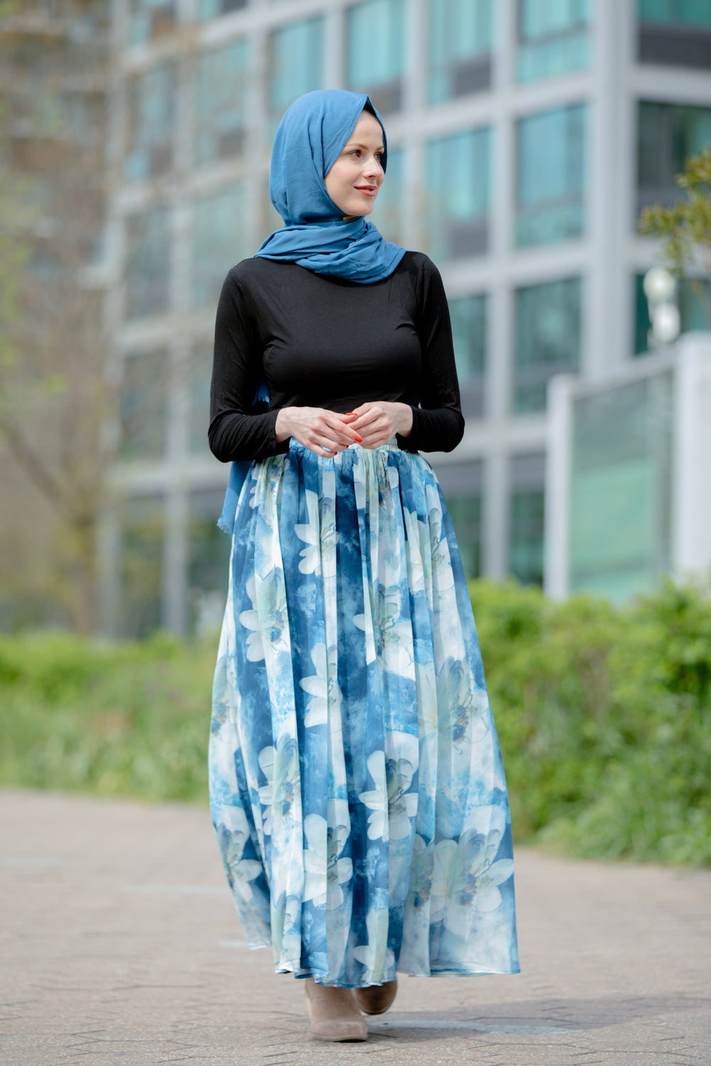 Woman in a blue hijab and floral skirt modeling Day Dreams Floral Maxi Skirt