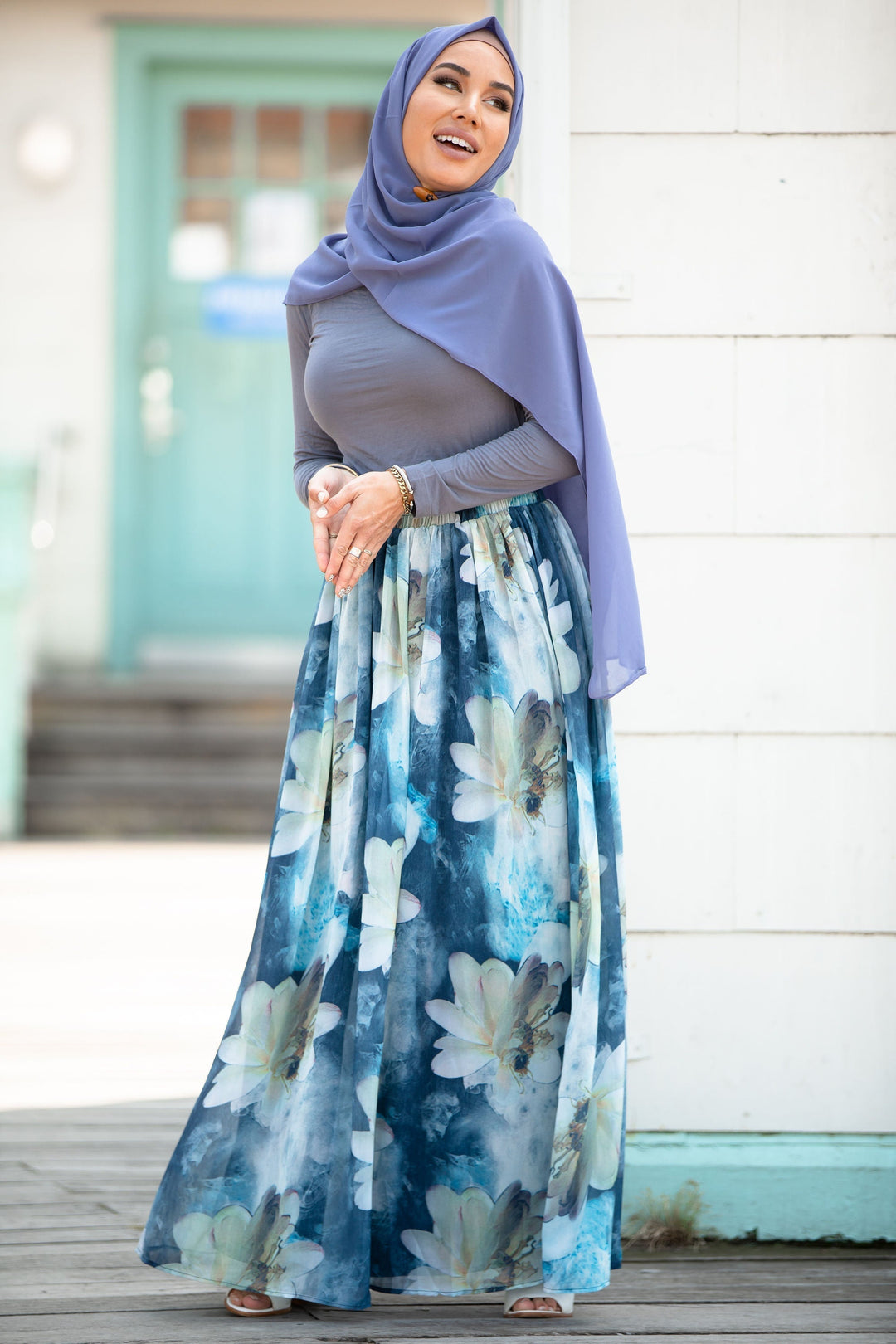 Woman in hijab wearing Day Dreams Floral Maxi Skirt on clearance sale