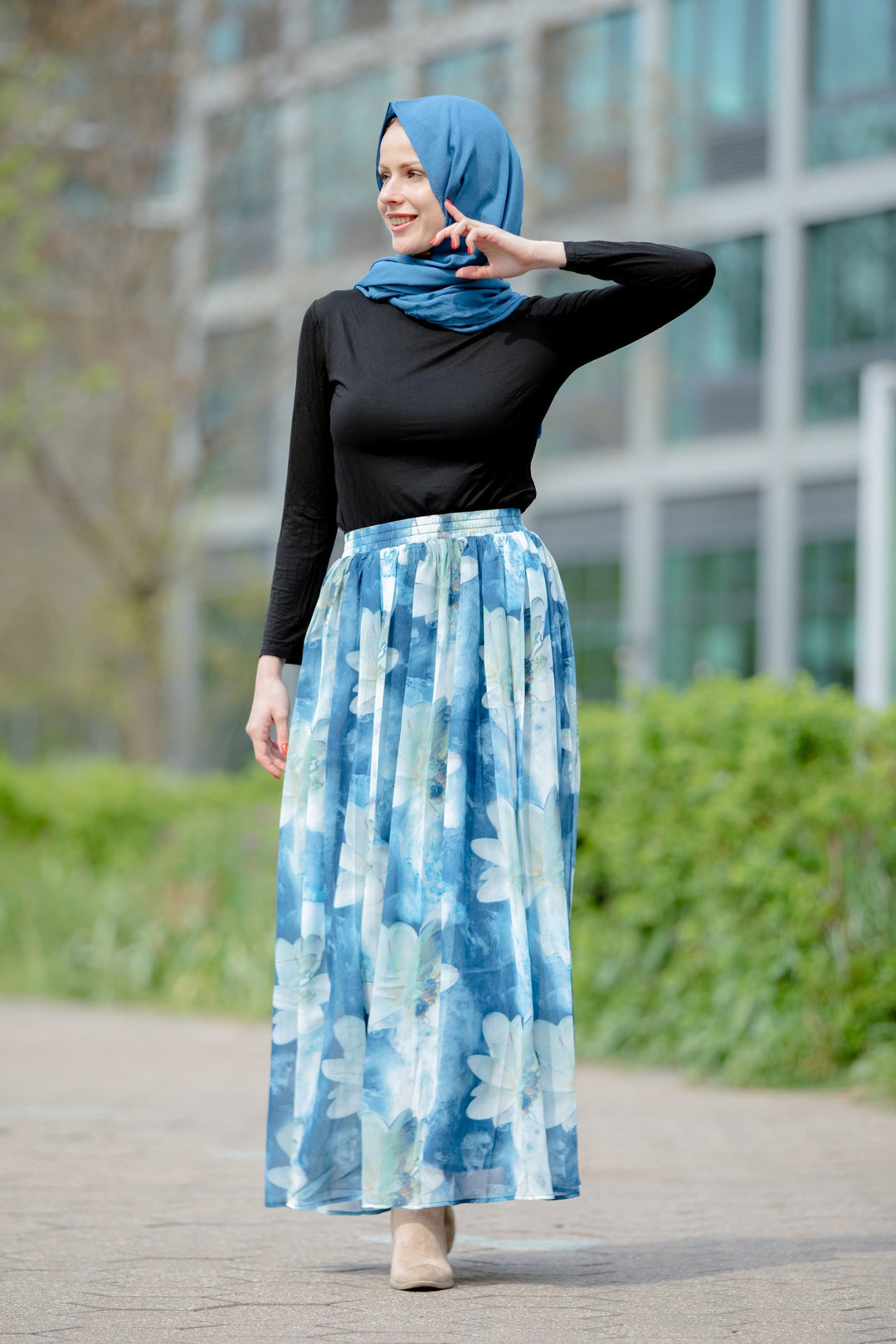 Woman in hijab wearing Day Dreams Floral Maxi Skirt in vibrant floral design