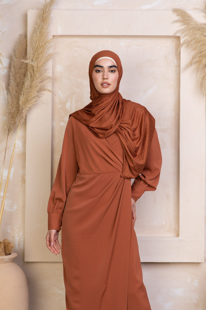 Rust-colored Deep Cider Wrap Maxi Dress with criss cross neckline and matching hijab