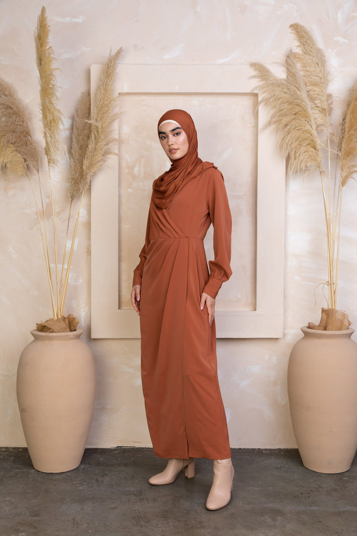 Woman in a Deep Cider Wrap Maxi Dress with criss cross neckline and hijab