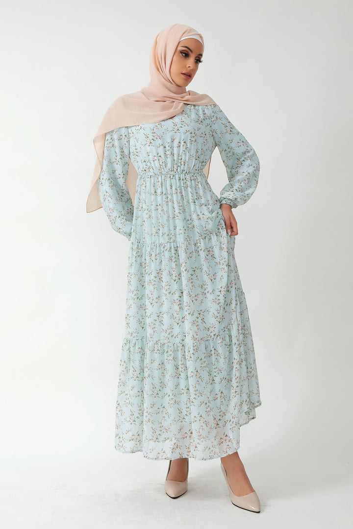 Woman in Dreamy Blue Floral Tiered Maxi Dress wearing a stylish hijab