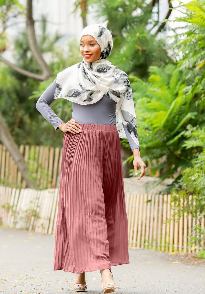 Woman in hijab wearing a Dusty Pink Pleated Chiffon Maxi Skirt with elastic waistband