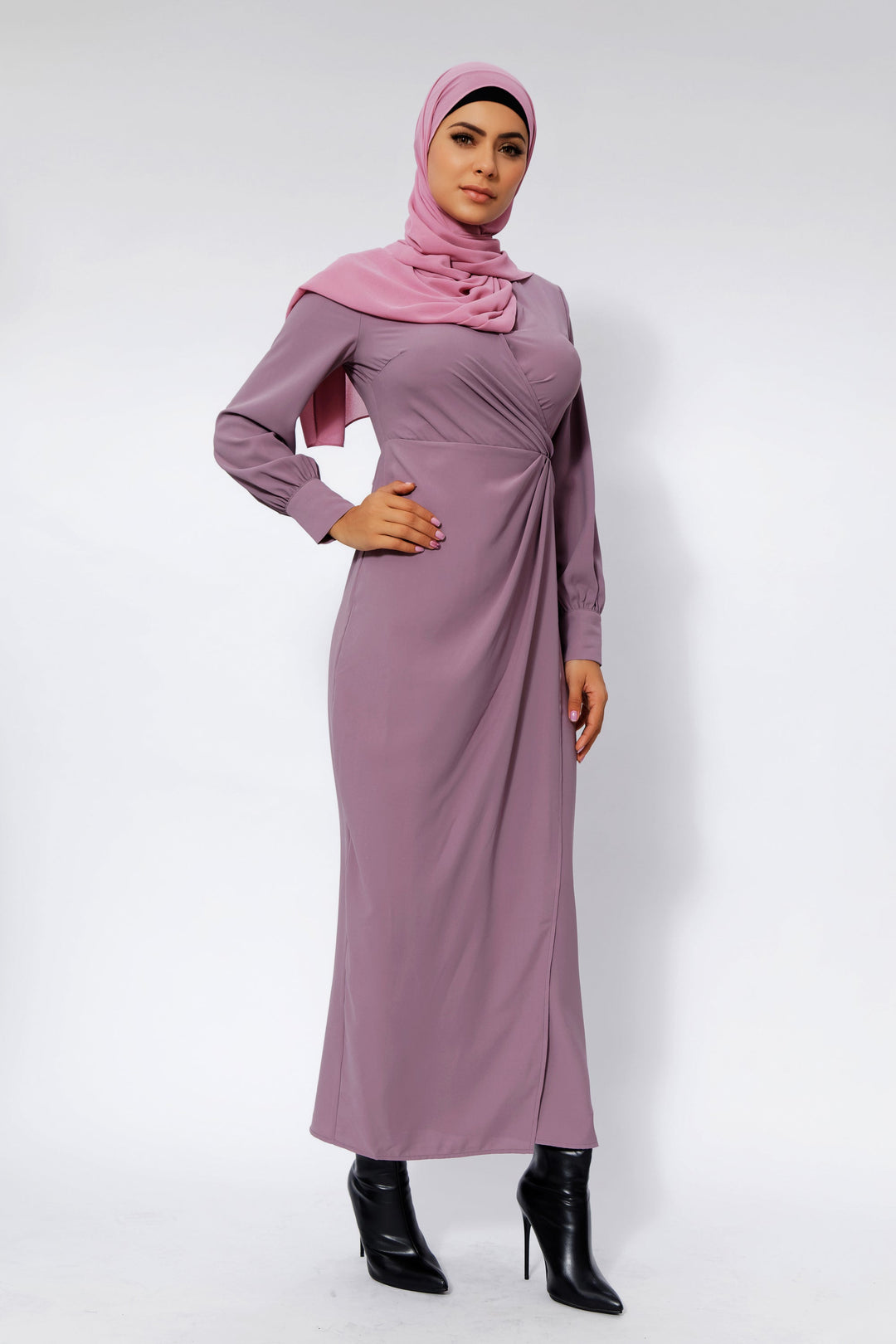 Woman in a mauve dress and hijab wearing a Dusty Purple Wrap Maxi with criss cross neckline