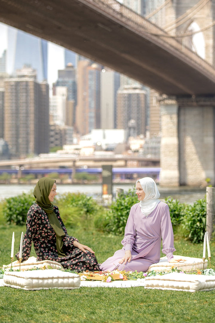 Two women in hijabs enjoying a picnic in Dusty Purple Wrap Maxi Dresses