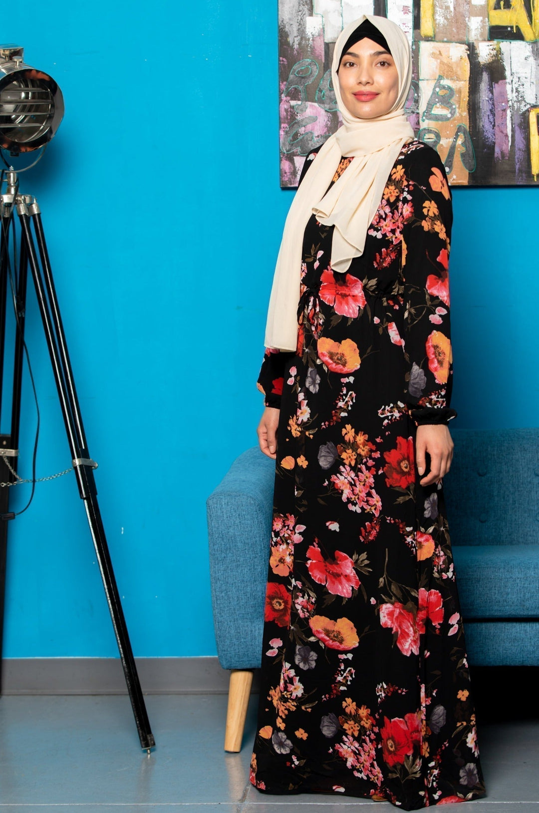 Woman in floral maxi dress with hijab showcasing the Floral Drawstring Maxi Dress