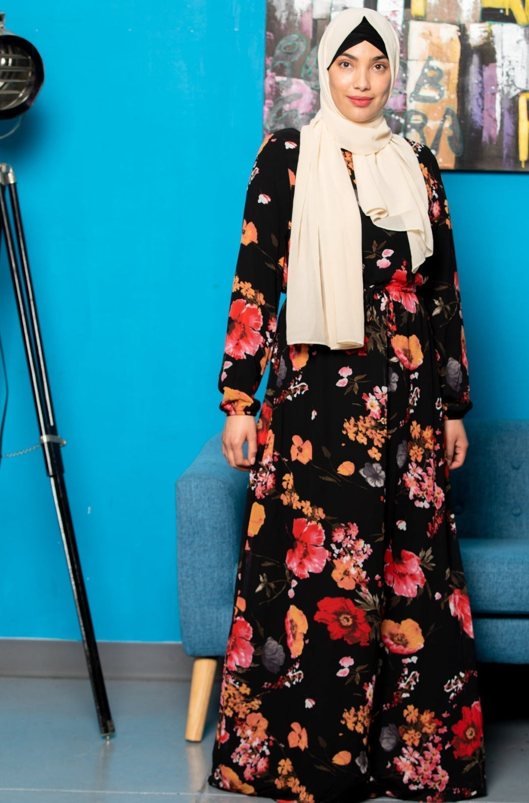 Woman wearing a floral drawstring maxi dress with elastic cuff and hijab