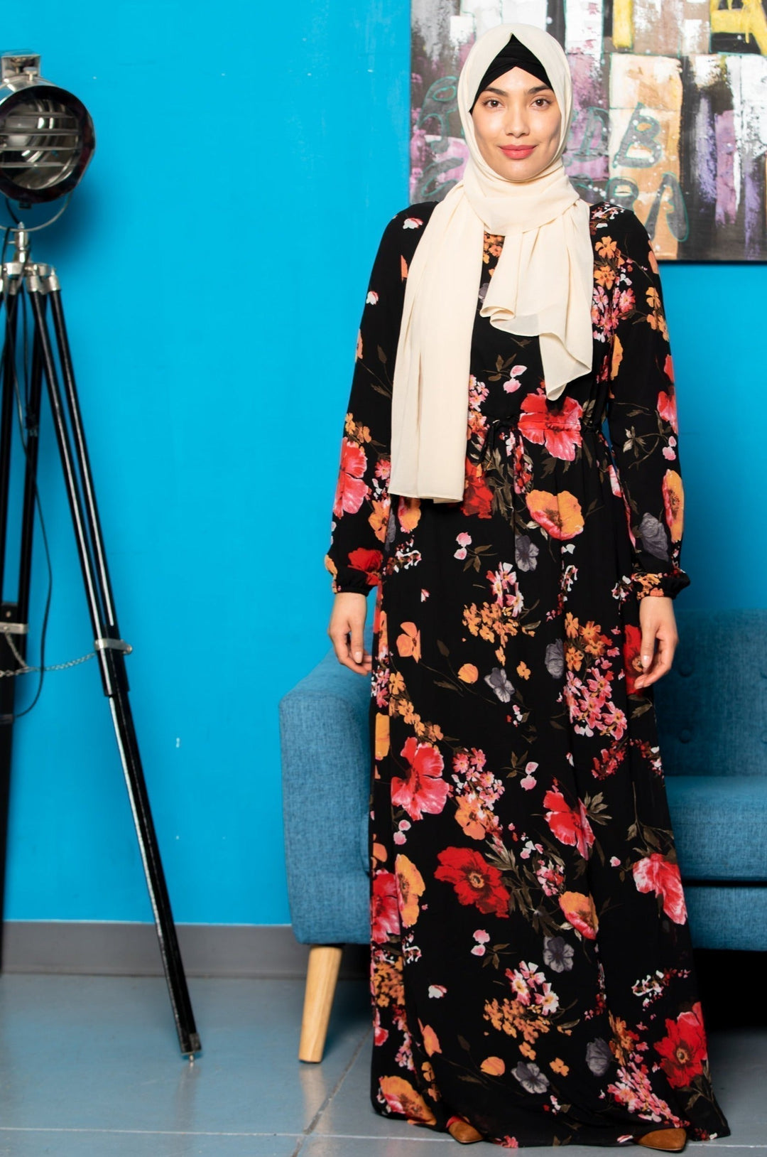 Woman in floral dress with hijab wearing the Floral Drawstring Maxi Dress on CLEARANCE