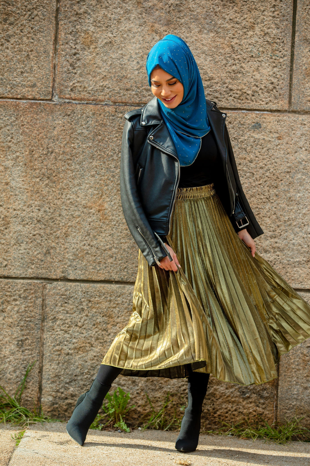 Stylish woman in hijab wearing a Gold Metallic Pleated Chiffon Maxi Skirt on clearance